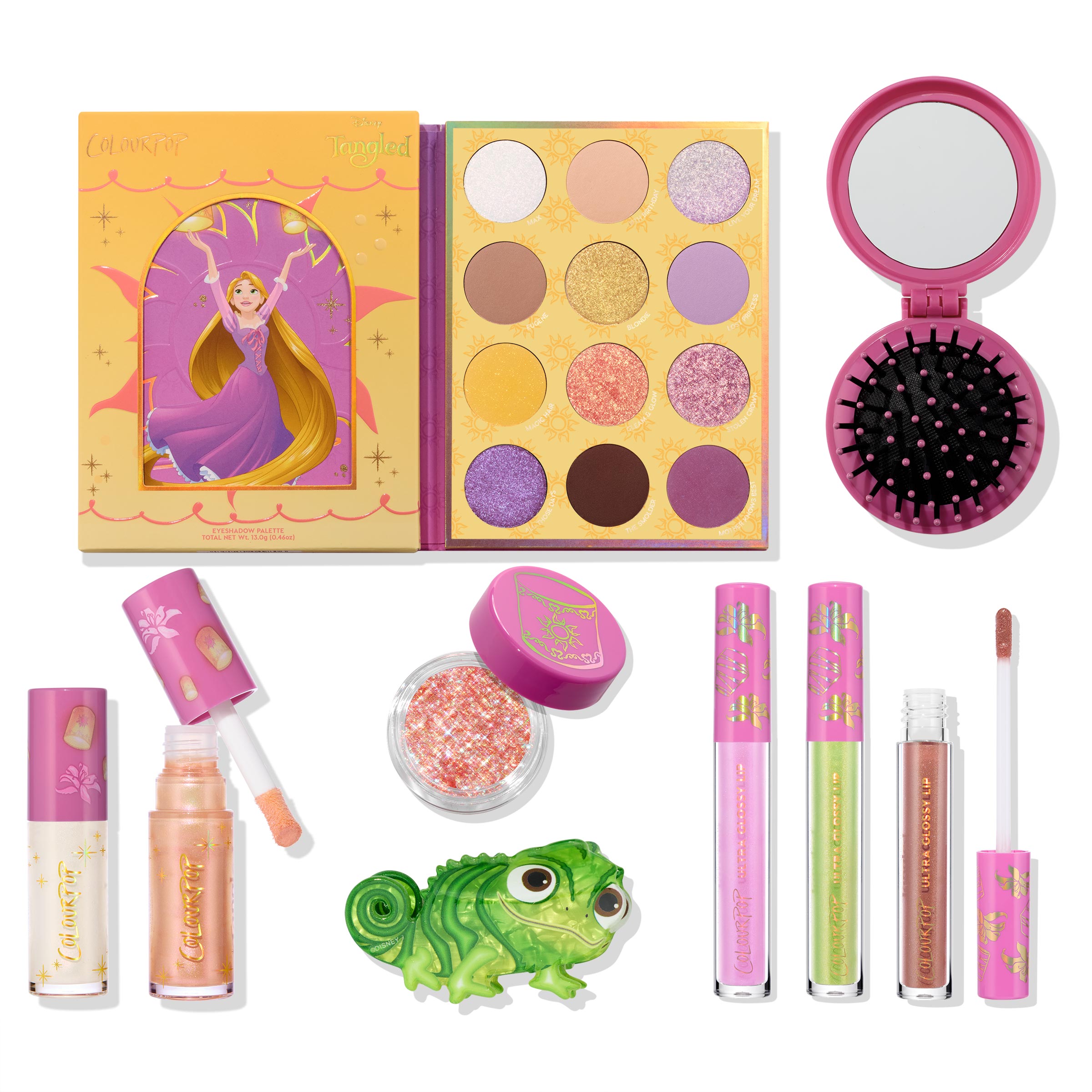 Disney Tangled and ColourPop Collection full collection set laid out on white, featuring Rapunzel-themed eyeshadow palette, glitter pot, pink compact brush, lip glosses, and Pascal figurine, promoting Back In Stock ColourPop makeup.