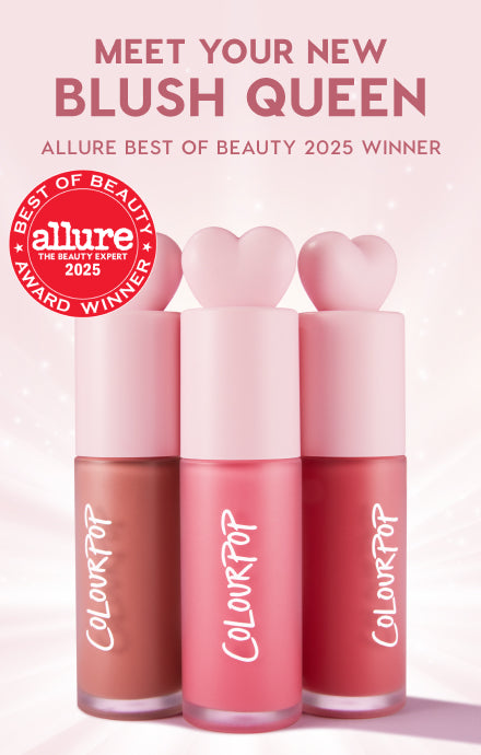 Three ColourPop liquid blushes with heart-shaped pink caps stand upright, showing nude, rose, and berry shades on a soft pink backdrop with an Allure Best of Beauty 2025 Winner badge and a Meet Your New Blush Queen headline.