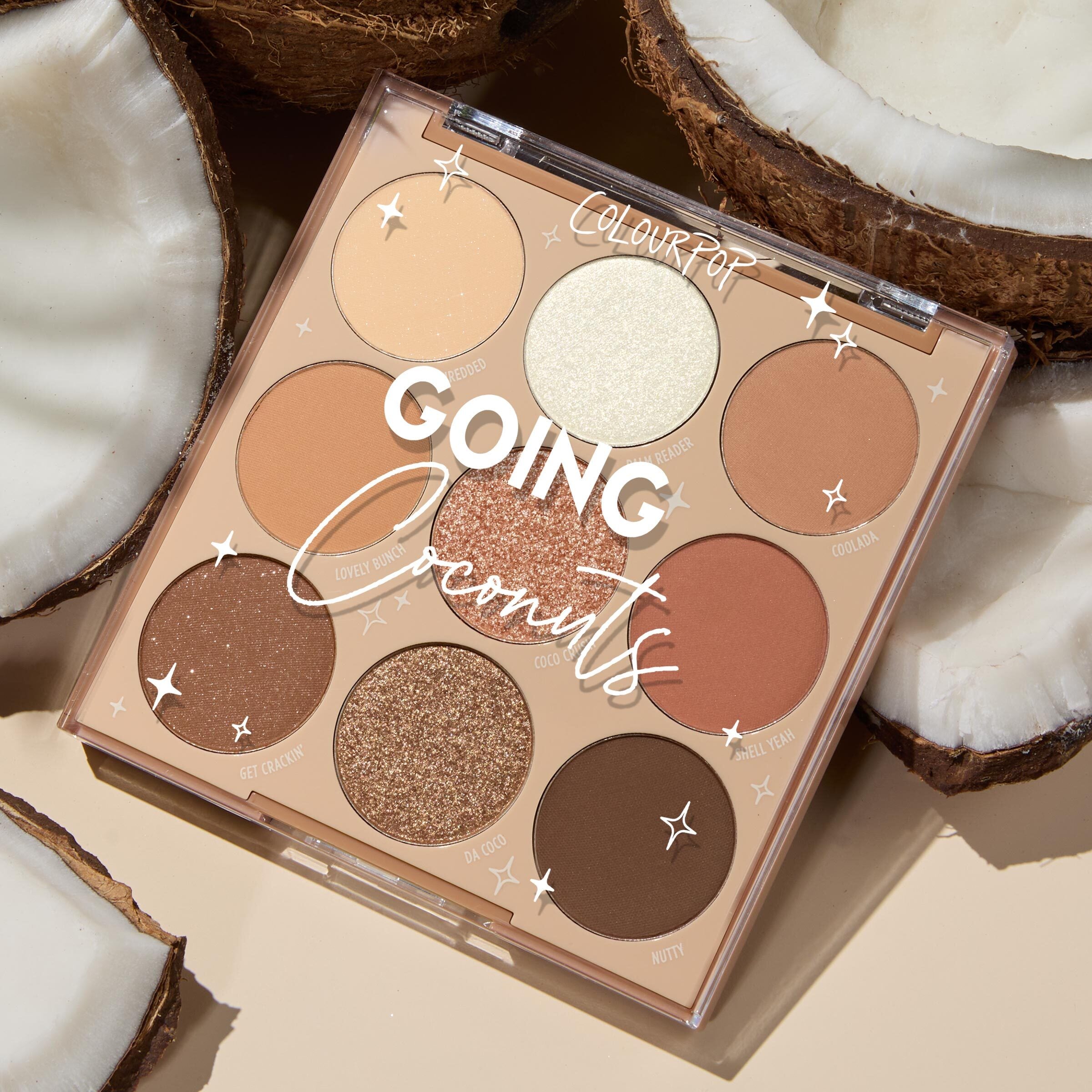 ColourPop Shadow Palette Going Coconuts lies open to reveal a 9‑pan 3x3 grid of warm neutral browns and champagnes in matte and shimmer finishes, styled among cracked coconut halves on a beige surface.