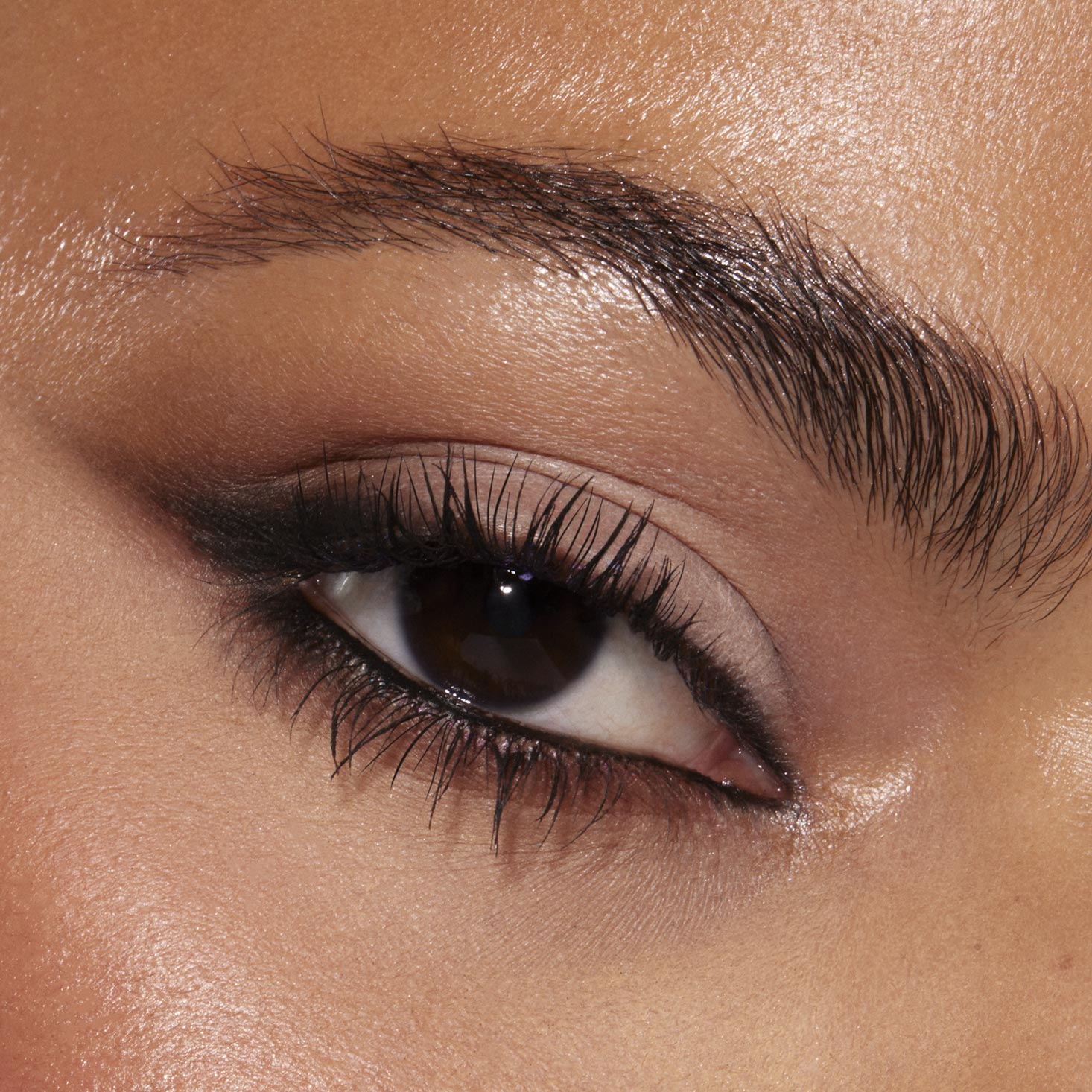 Smoky neutral eye blends taupe lids with soft black liner and natural lashes, showcasing Stone Cold Fox, a ColourPop Shadow Palette, in a close-up of the eyelid and brow for a cool-toned, wearable glam look.