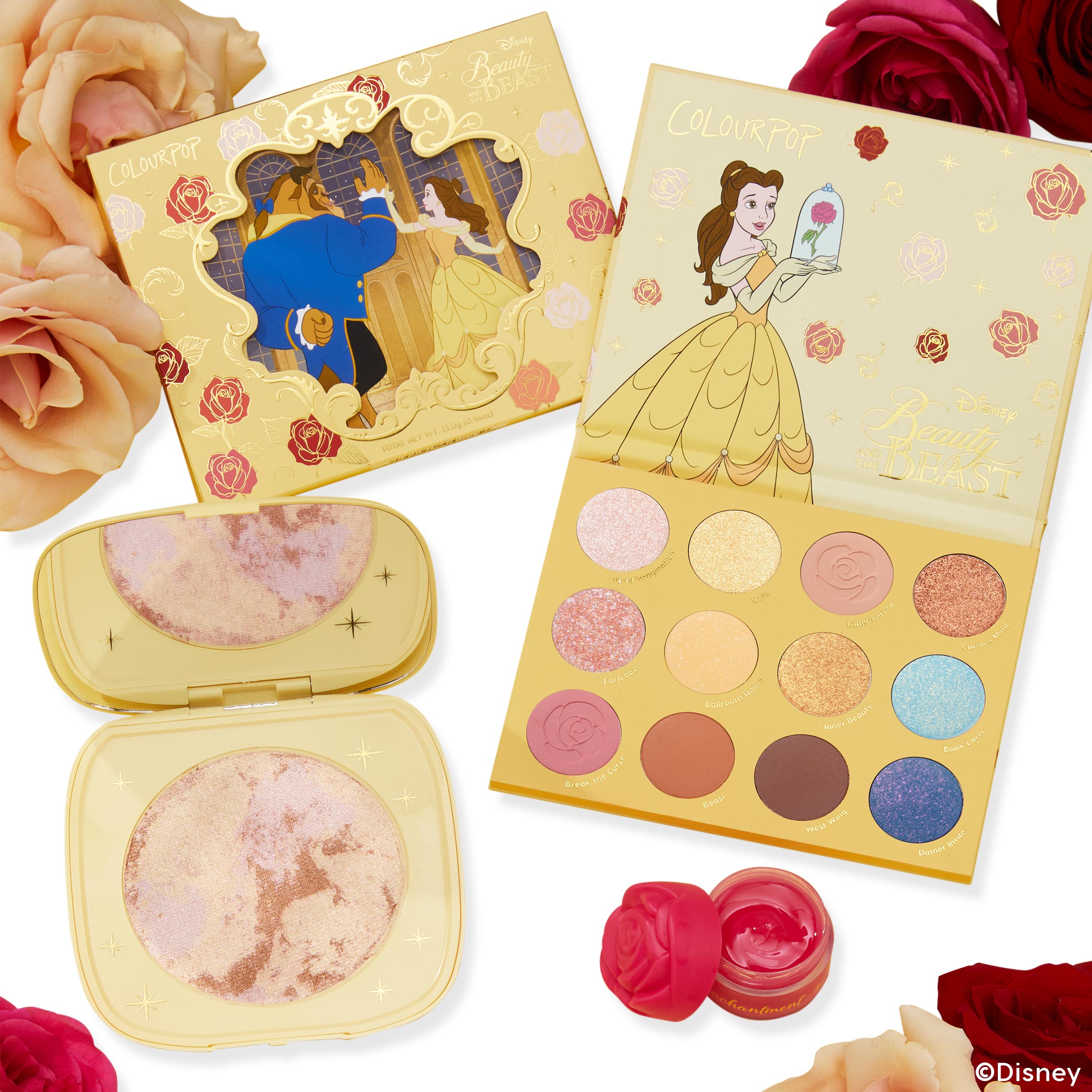 ColourPop As Old As Time Shadow Palette, Cheek, & Lip Set displaying an open 12-shade Beauty and the Beast eyeshadow palette, gold marbled cheek highlighter compact, and rose-shaped lip balm pot, arranged in a white flat lay with pink and red roses.