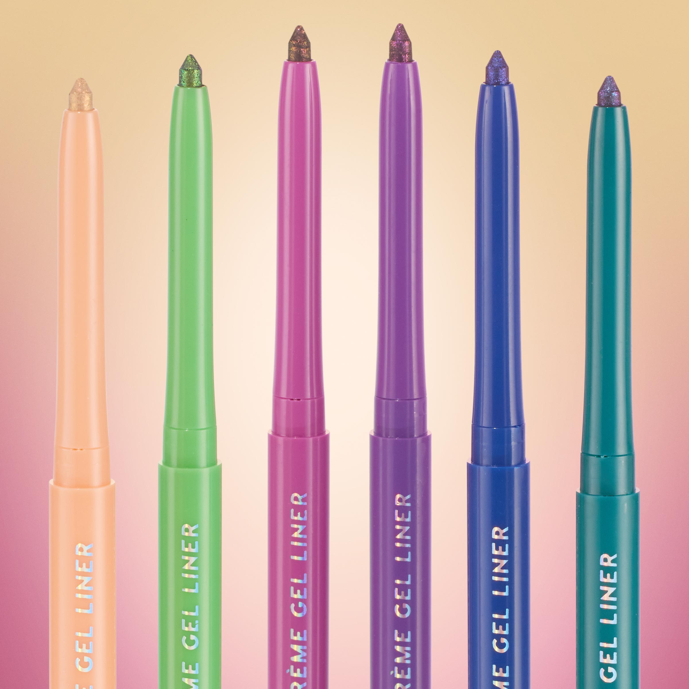 Six Chrome Hearted ColourPop Chrome Crème Gel Liner pencils stand uncapped, showcasing chrome shimmer tips; retractable barrels in peach, lime, fuchsia, purple, cobalt, and teal line up against a soft pastel gradient background.