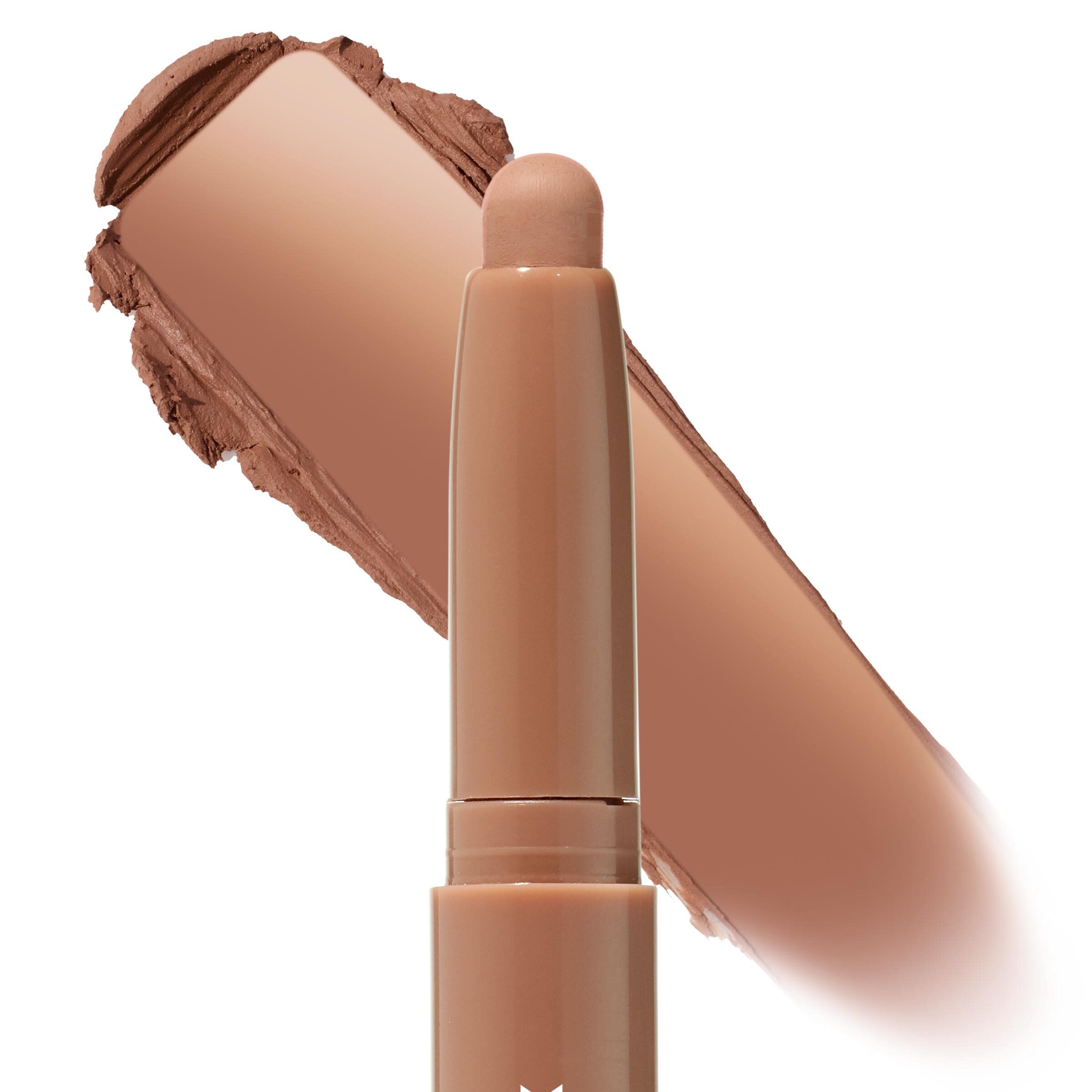 ColourPop Shadow Stix in Cocktail Party displaying a rounded twist-up tip beside a wide swipe of warm caramel-brown pigment, showing smooth, blendable, satin payoff against a clean white background.