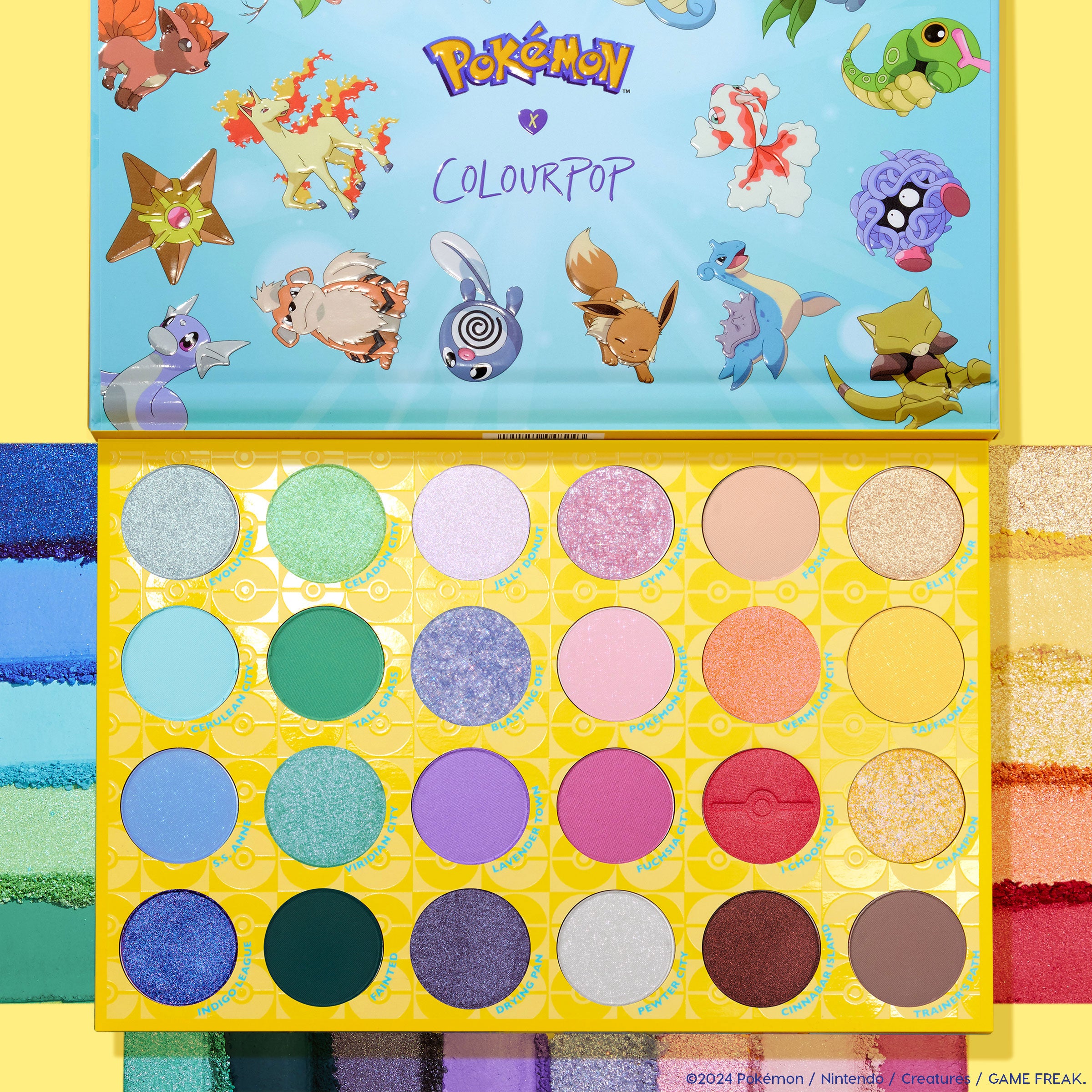 Ready For Battle ColourPop Shadow Palette & Ultra Glossy Lip Set - open Pokémon x ColourPop palette shows 24 vibrant matte and shimmer shades in a yellow Poké Ball grid, character art on the lid, and rainbow swatches framing the product.