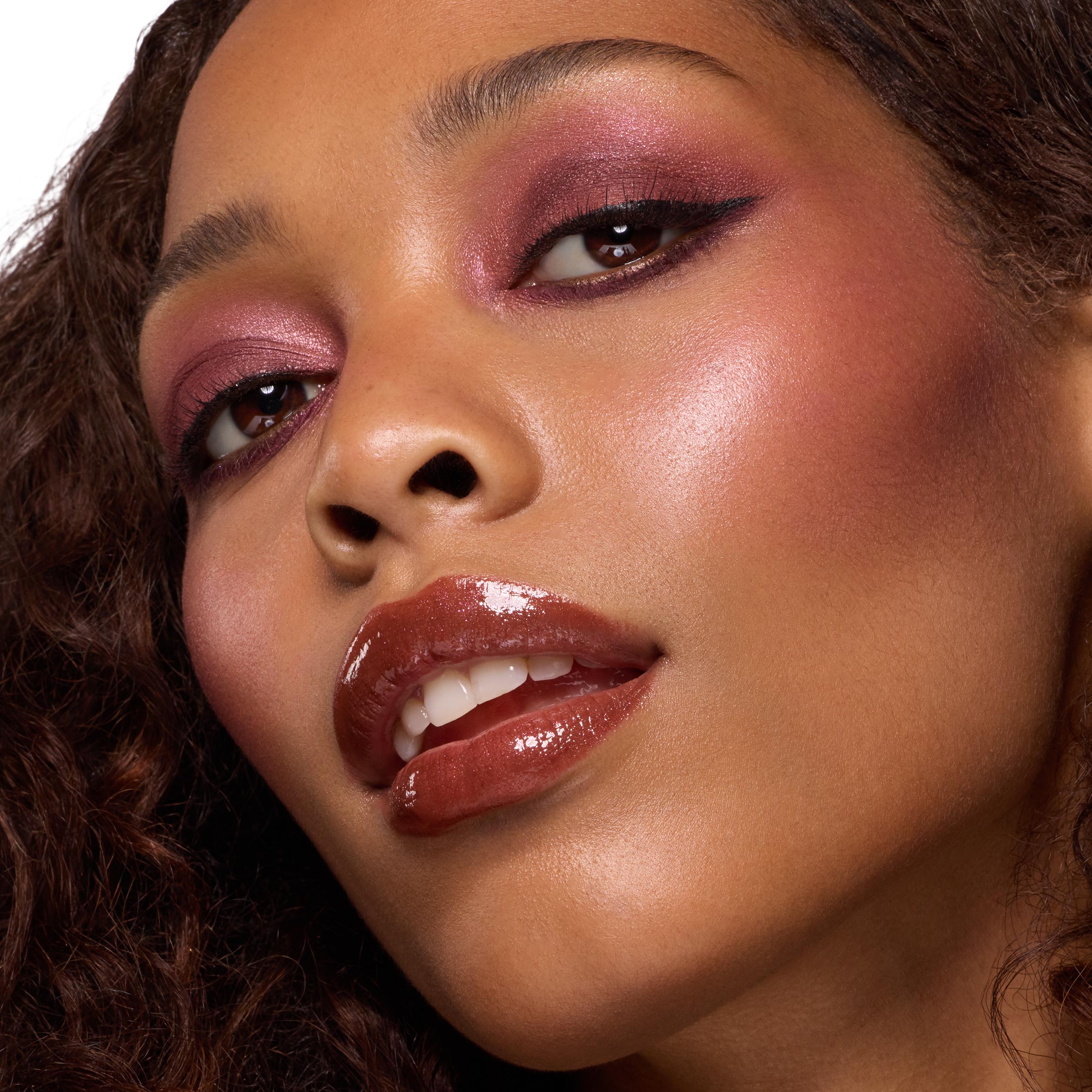 ColourPop Wine and Only Shadow Palette creates a wine-toned eye look, blending shimmery burgundy and plum with soft winged liner, shown in a studio close-up with glossy brown lips and radiant cheeks.