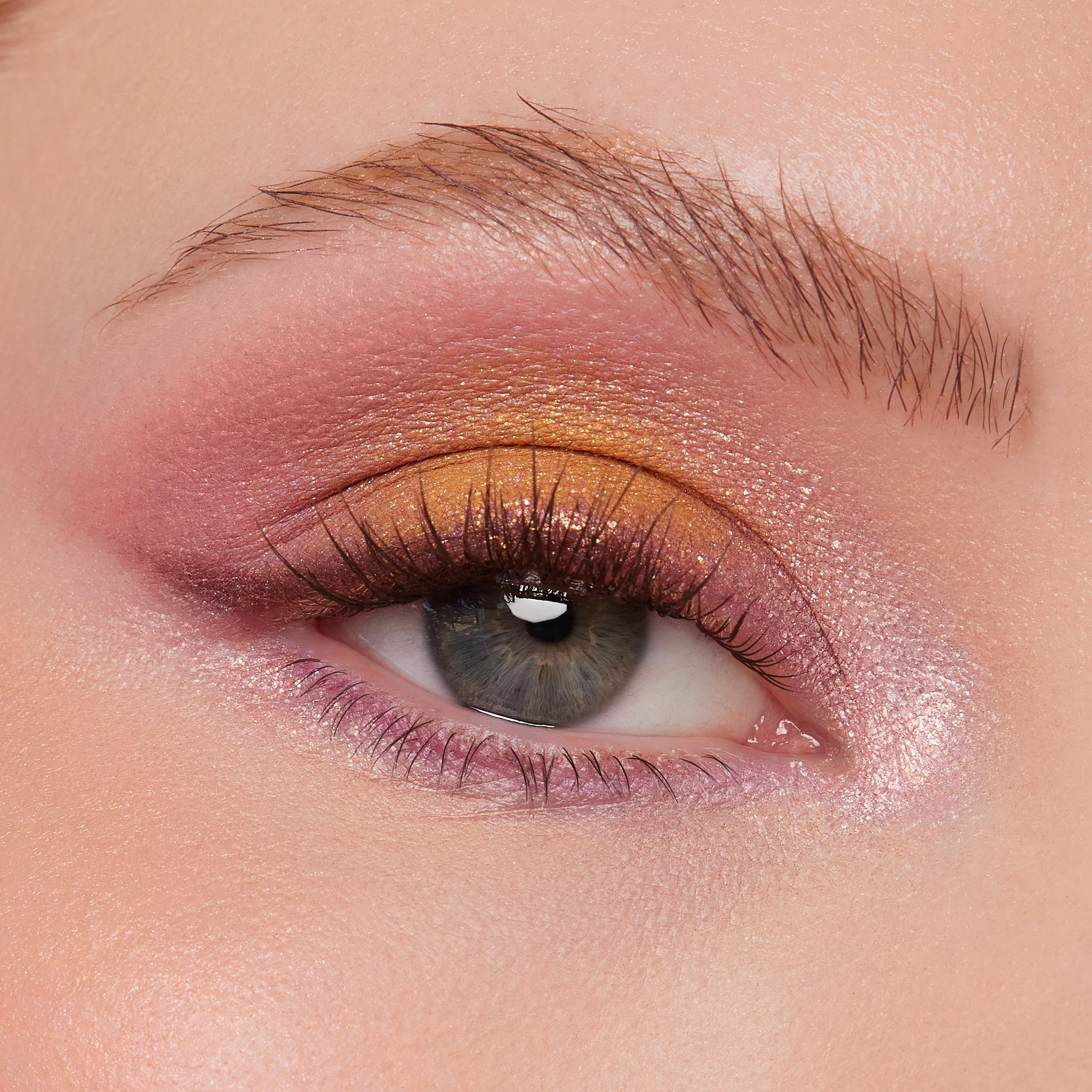 Shimmering eye look showcasing sunset copper-to-gold lid, rose-mauve crease, and lilac inner corner and lower lash line on a single eye with defined lashes; created using the Best Day Ever Shadow Palette, a ColourPop Shadow Palette.