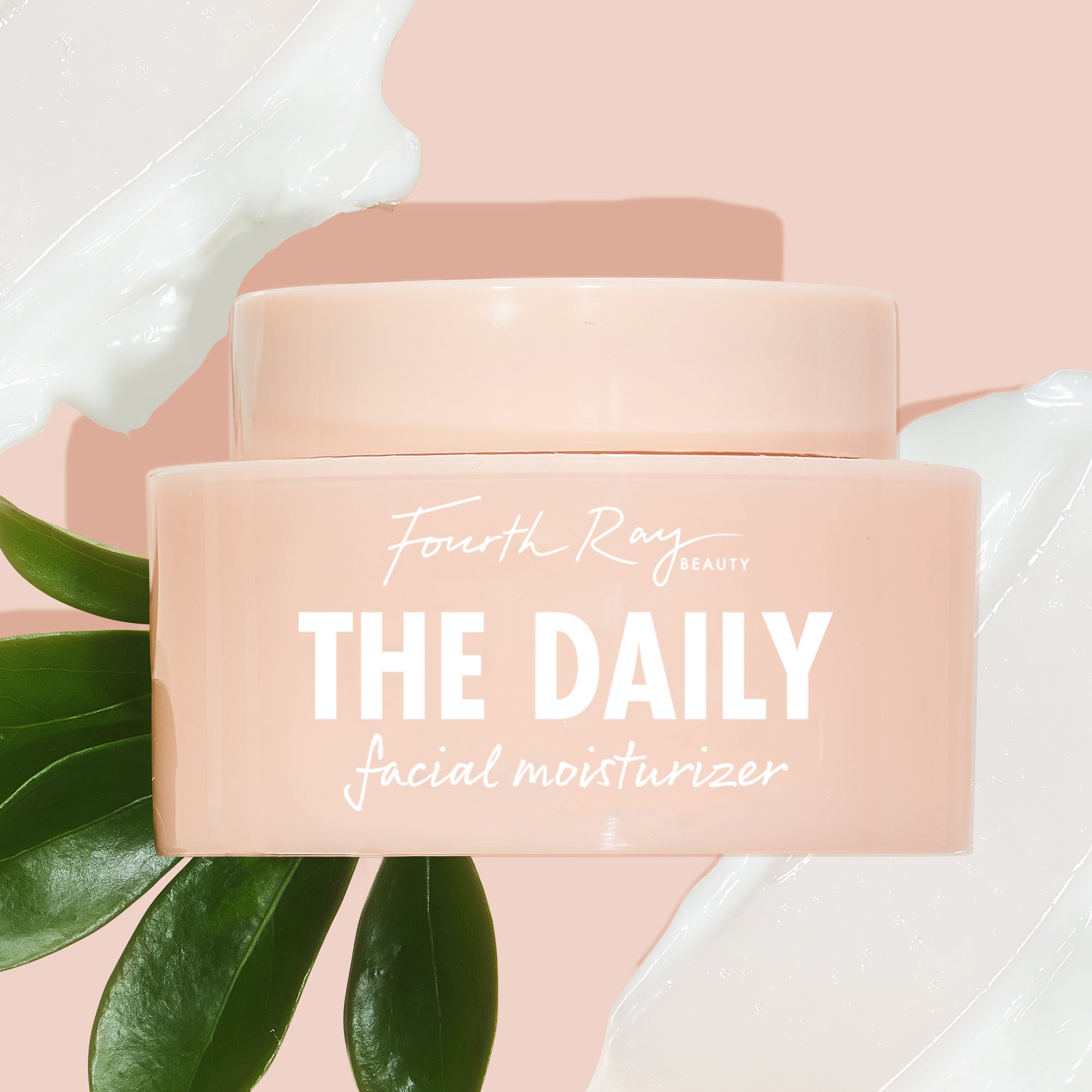 Peach-pink jar of The Daily Face Cream by Fourth Ray Beauty resting on glossy green leaves, flanked by white cream swipes on a blush background, highlighting this hydrating ColourPop Face Moisturizer for everyday use.