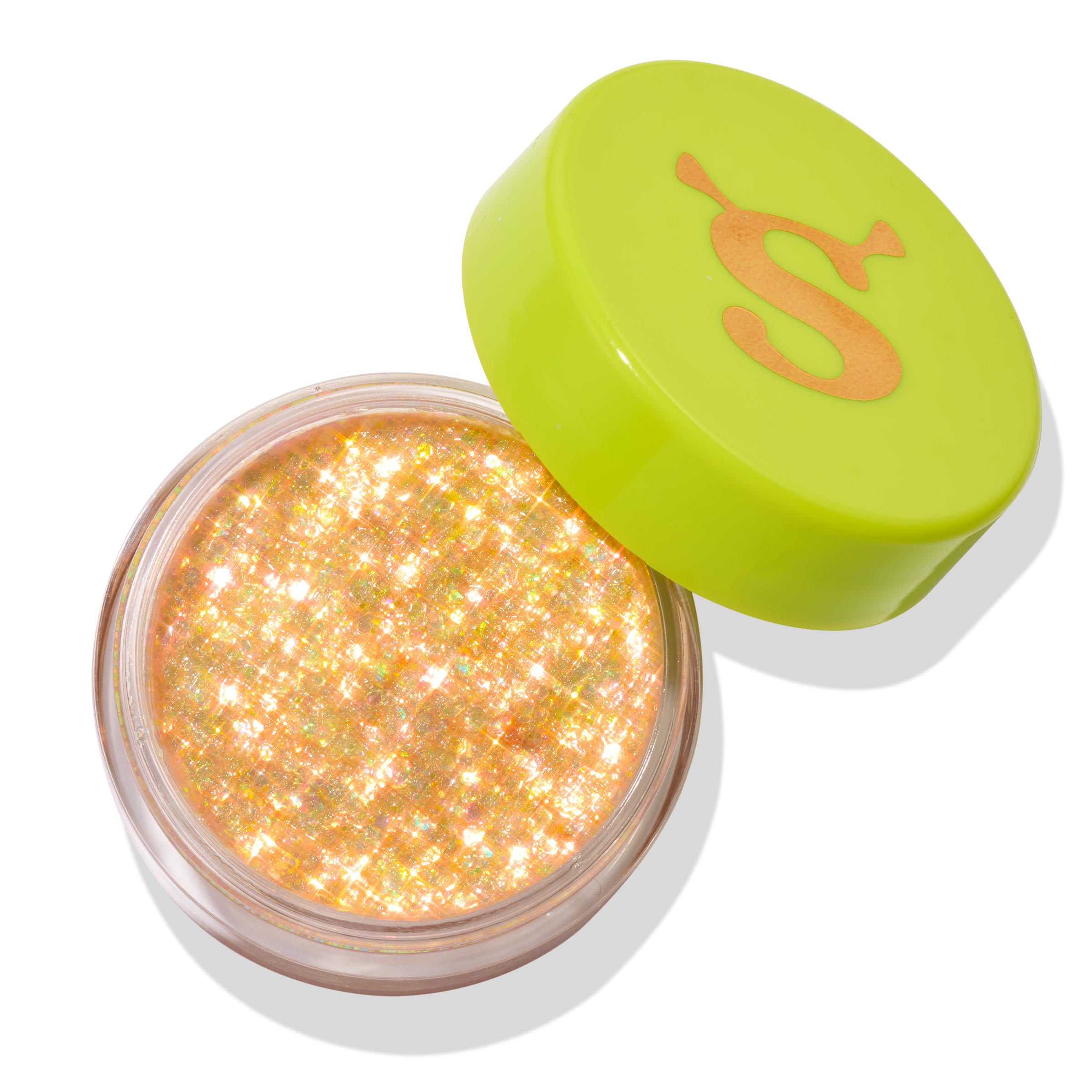 Open jar of ColourPop Glitter Gel, Ogres are Like Onions, shimmering with dense iridescent gold‑peach glitter flakes, rests on a white background with a lime green cap featuring an orange “S” set ajar.