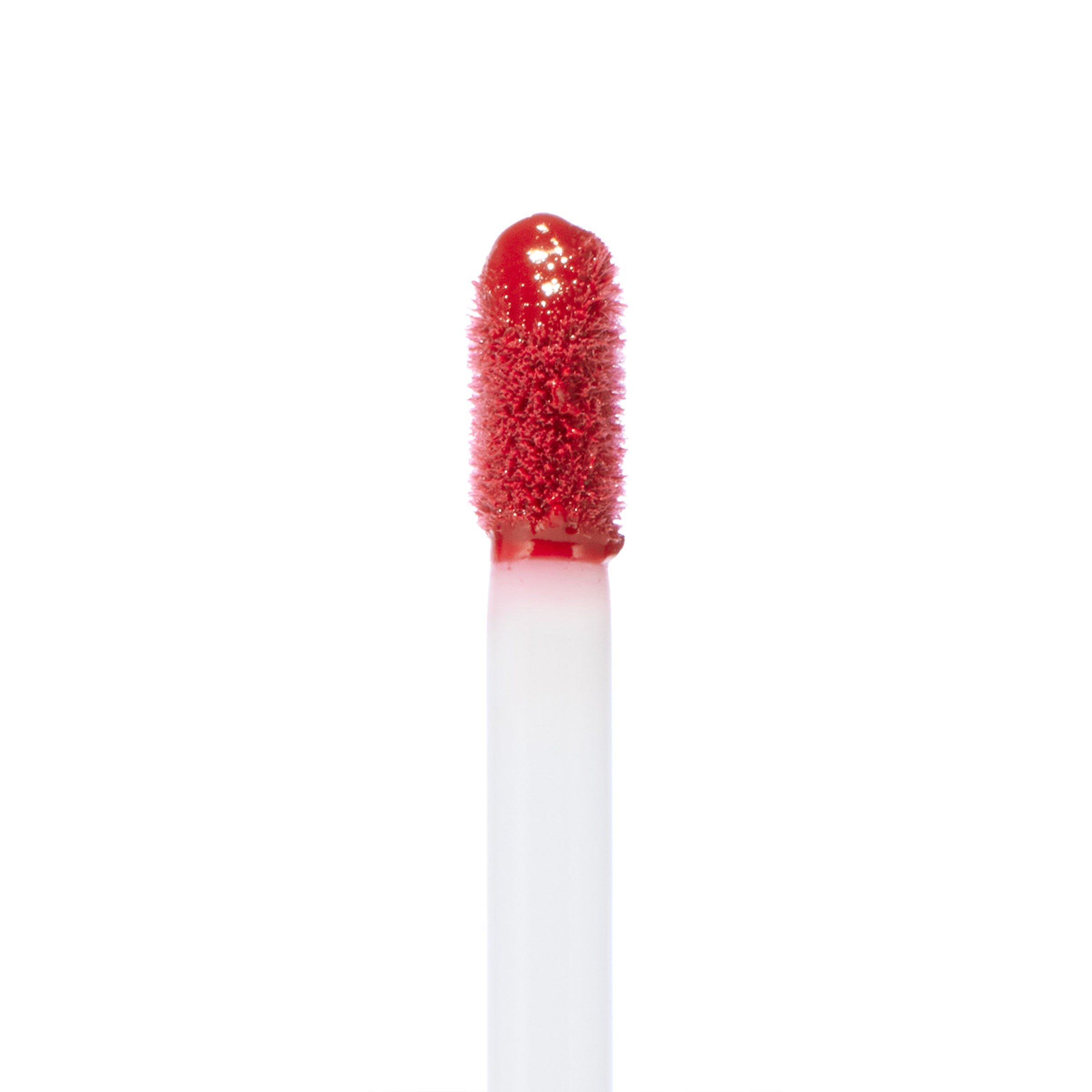 Doe-foot applicator coated in rich rosy-red lip color, displaying the Keep It Classy Ultra Blotted Lip shade from the ColourPop Ultra Blotted Lip line, upright against a clean white background to highlight texture and pigment.