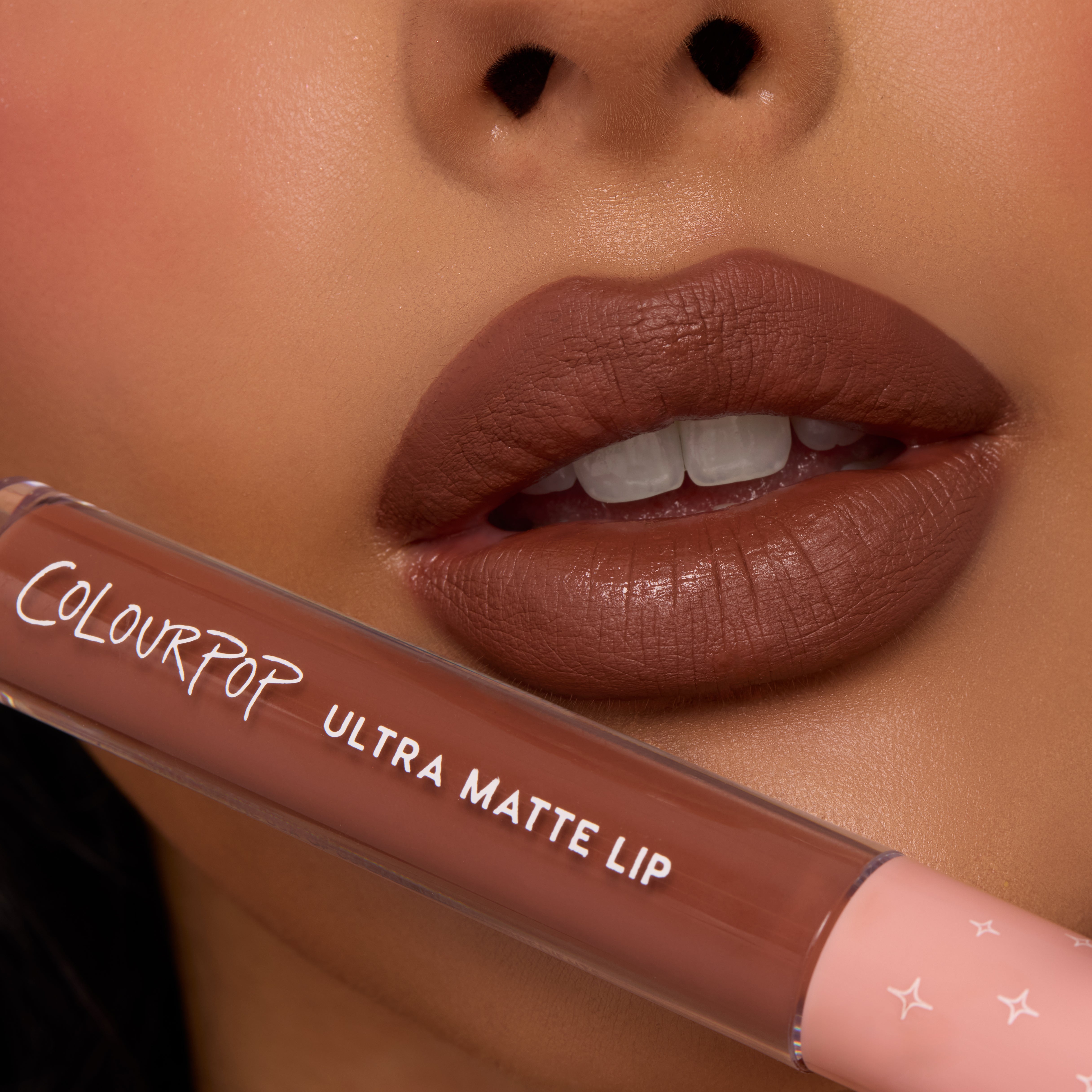 Full lips showcase Espresso Martini, a rich mocha-brown shade with a soft, diffused matte finish, while a ColourPop tube rests below; ColourPop Ultra Blotted Lip delivers lightweight, blurred color for everyday wear.