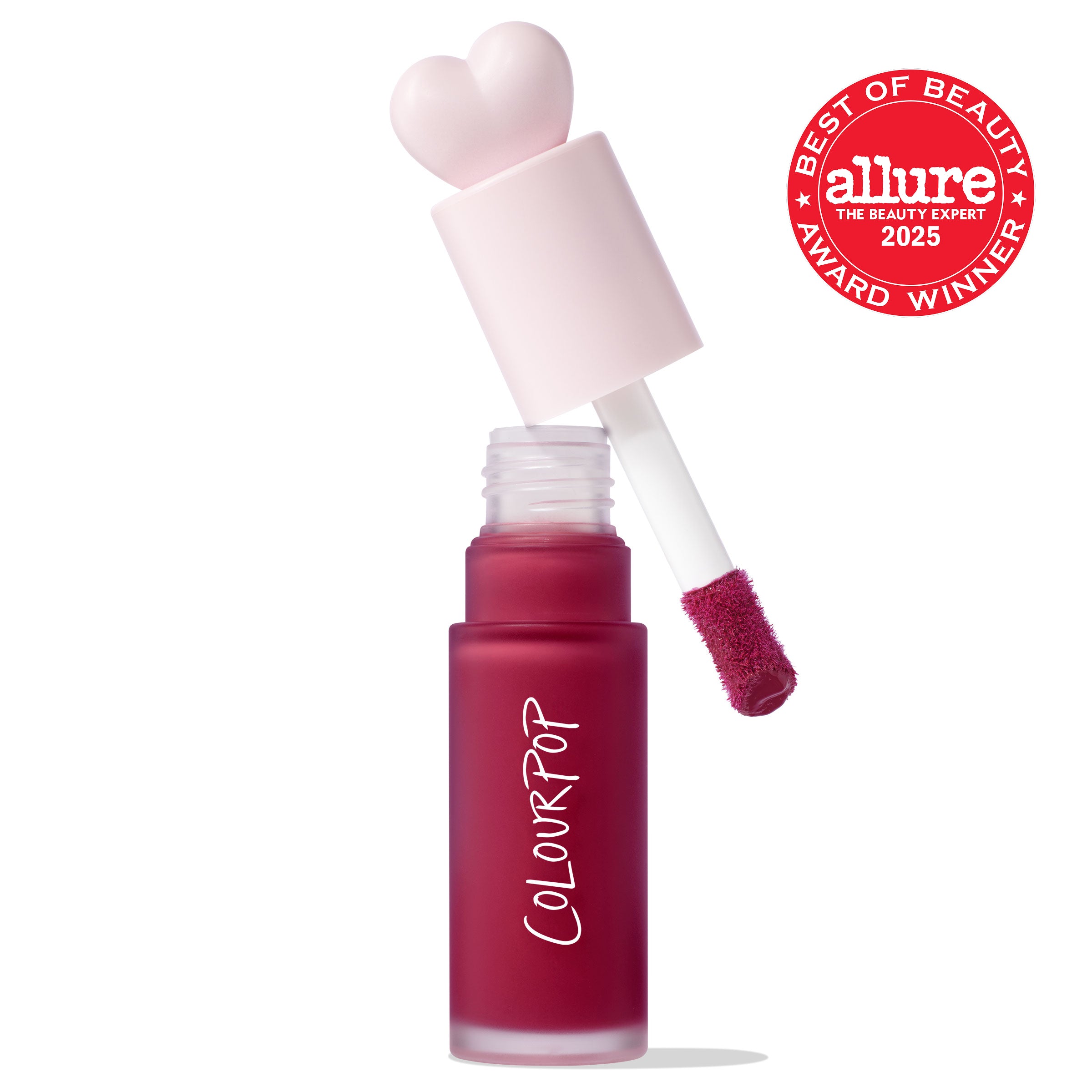 ColourPop Liquid Blush Royal Flush displayed open, doe-foot applicator lifting a berry-red tint from a frosted bottle labeled COLOURPOP, pink heart-shaped cap beside it, with a red Allure Best of Beauty 2025 award badge on a white background.