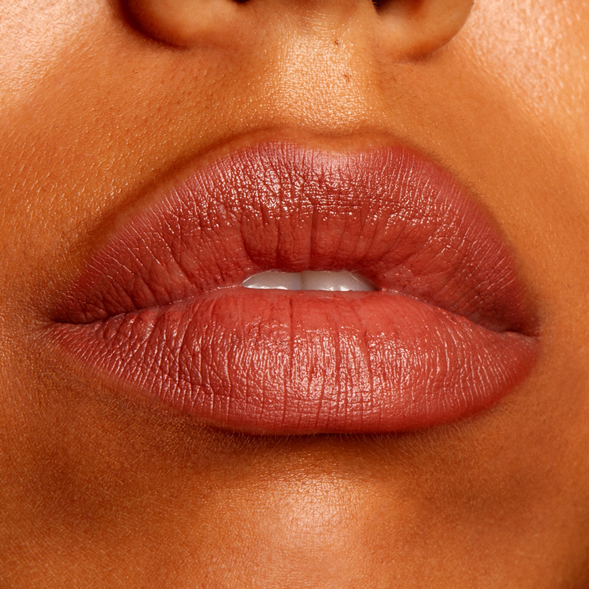 Lips wearing BFF2 ColourPop Lippie Pencil, lining and filling in a warm rosy-brown nude with a creamy satin finish; close-up beauty swatch showing precise lip definition and smooth texture.