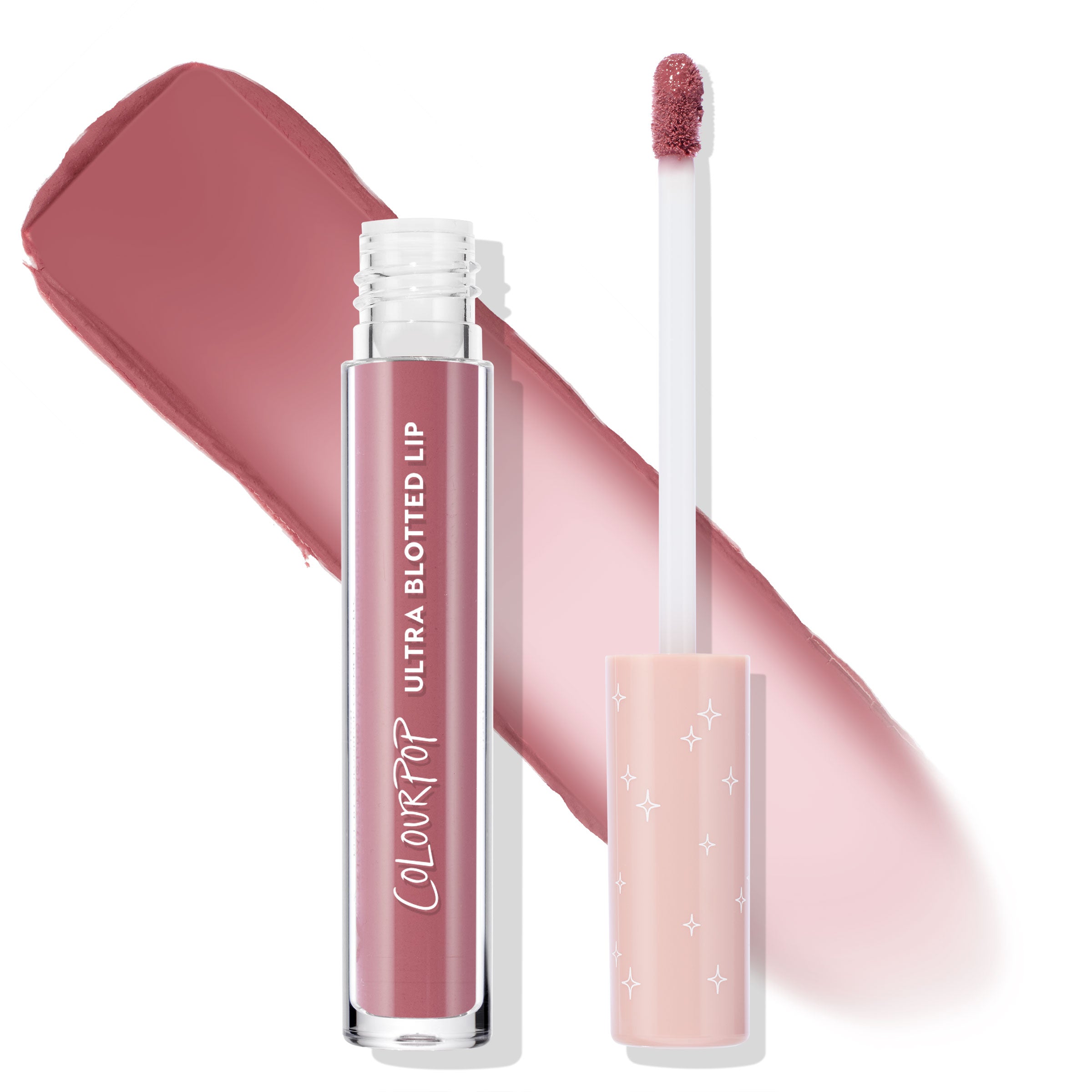 ColourPop Ultra Blotted Lip in Rose Latte shown open, the clear tube and doe-foot applicator swatching a rosy mauve stain, with a blush-pink cap printed with white stars, set on a white background.