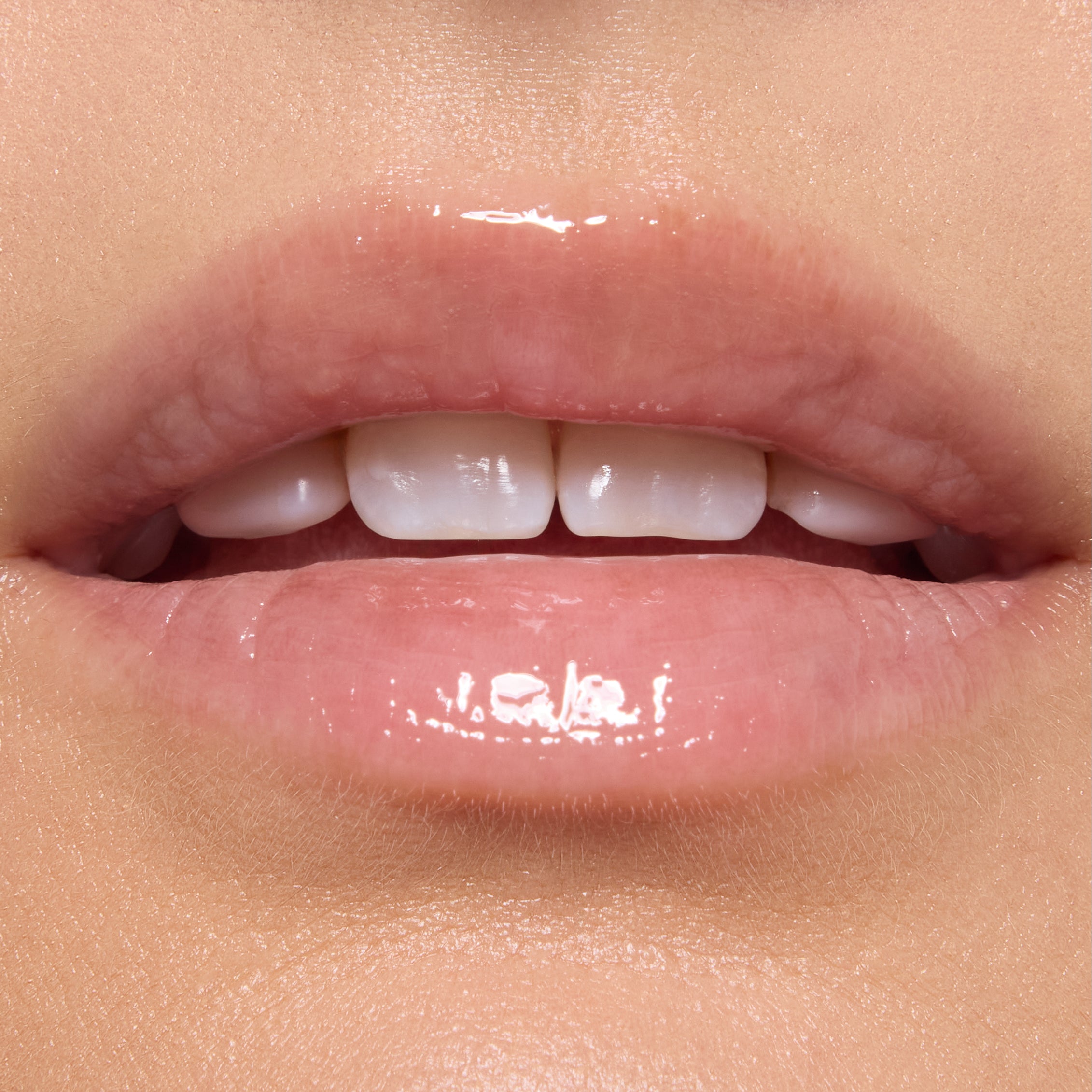 Glossy, translucent pink lips catching light in a tight studio close-up, wearing hydrating lip oil from the Shrek‑Spress Yourself ColourPop Lip and Eye Set, emphasizing smooth shine and soft natural color for everyday makeup.