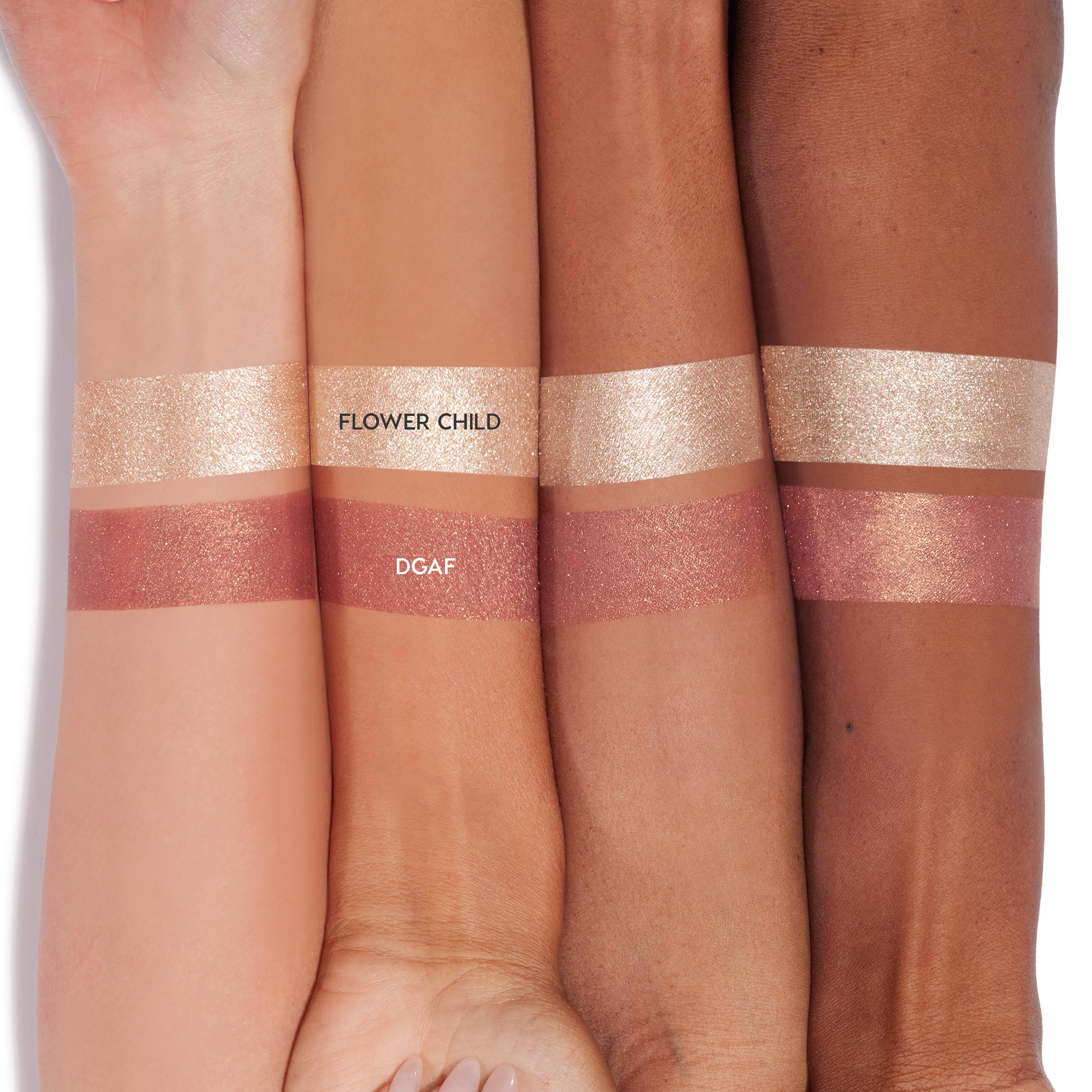 Flower Child swatched as a metallic champagne band on four forearms above DGAF, a warm copper shimmer, showing color payoff and sparkle of the creamy ColourPop Super Shock Shadow.