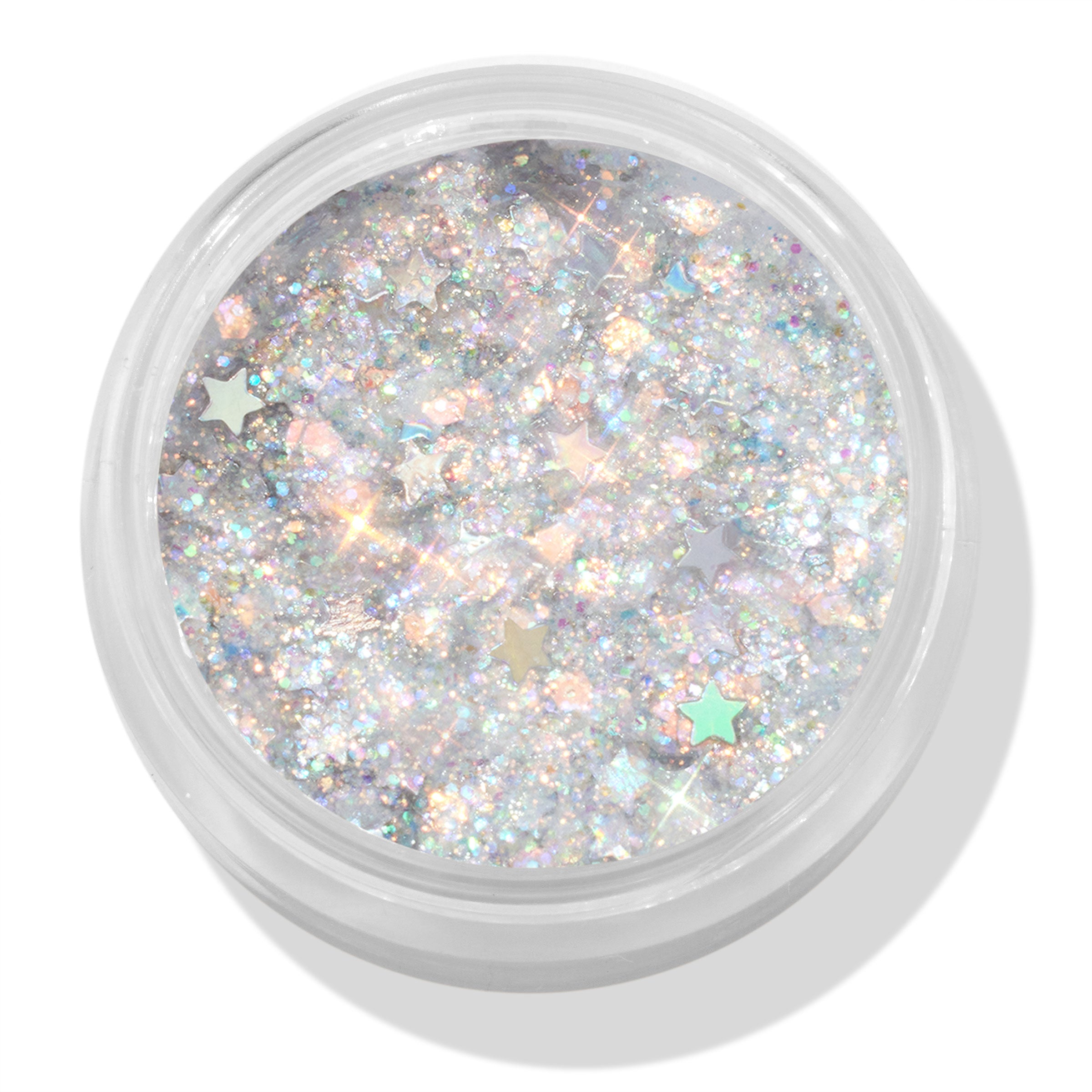 Ur A Firework ColourPop Glitter Gel sparkles with holographic silver micro-glitter and pastel star confetti, filling a clear round jar; top-down close-up shows the iridescent gel’s multidimensional shine on a white background.