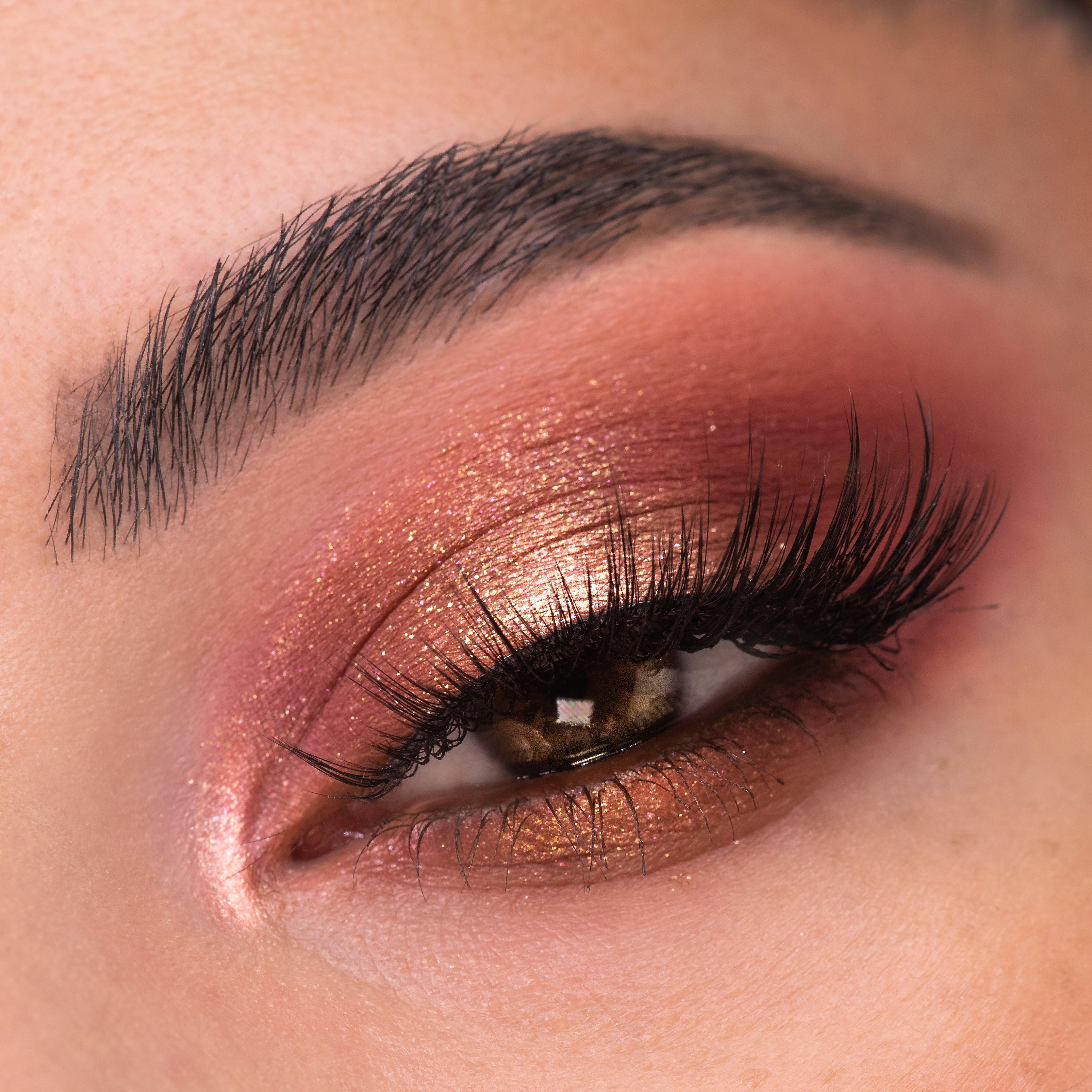 Shimmering rose-gold, copper, and berry eye look blends across the eyelid with a bright inner-corner highlight, showcasing By The Rosé Shadow Palette, a ColourPop Shadow Palette, on smooth skin with full lashes in a close-up.