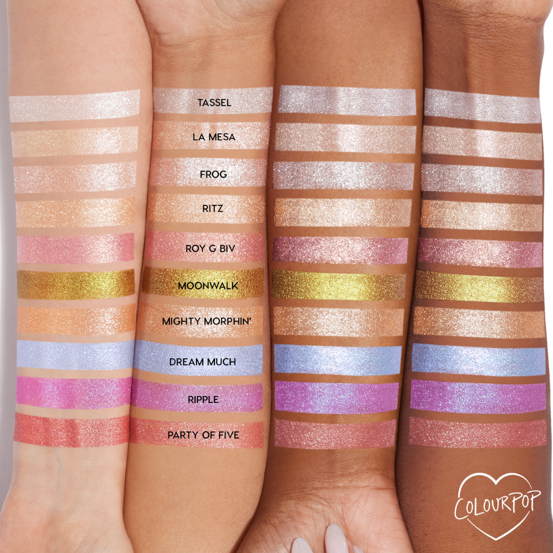 La Mesa ColourPop Super Shock Shadow swatched as a sheer champagne-beige shimmer across three arms in a lineup of labeled shades, showing its luminous, glittery finish and how the color reads on multiple skin tones.