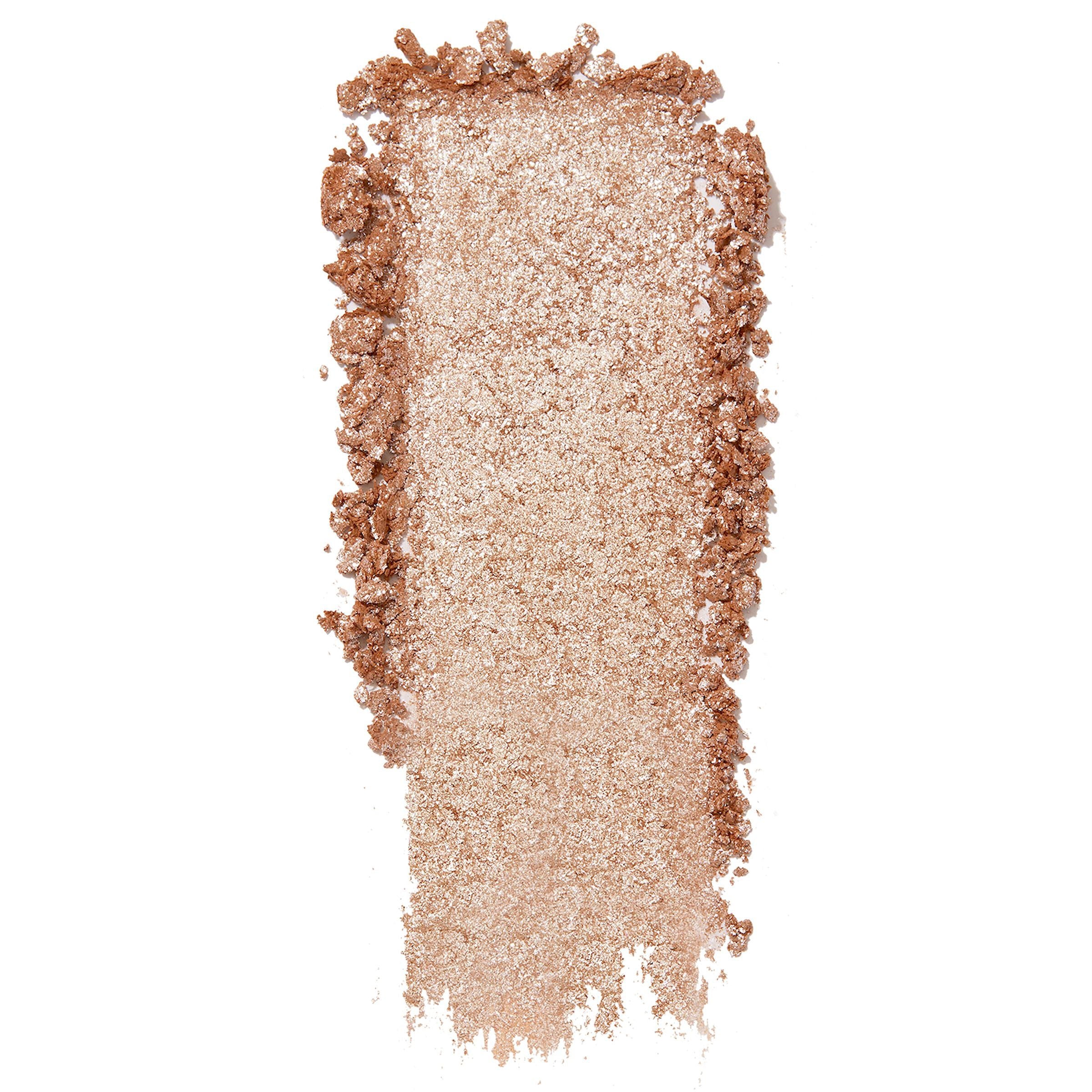 Ritz Super Shock Shadow by ColourPop, a shimmering champagne‑beige eyeshadow swatched in a wide metallic streak with scattered crumbles, showcasing ultra‑glitter payoff and creamy texture on a clean white background.