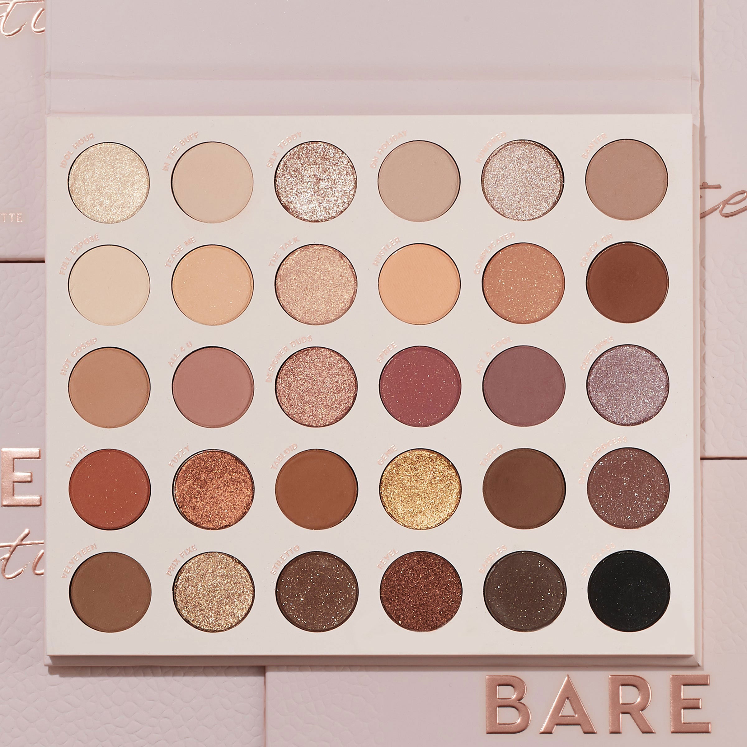 Bare Necessities ColourPop Shadow Palette showcasing 30 neutral matte and shimmer shades in a 6x5 grid - ivory, taupe, mauve, bronze, gold, deep brown, and black - laying open on blush-pink packaging with BARE lettering, ideal for everyday looks.
